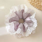 Gifty purple lace trim scrunchie displayed next to matching hair accessories