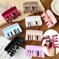 Beau plastic square claw clip in beige on white background