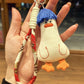 Blue duck keychain held in hand to show size and texture