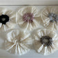 Chic large double layer lace scrunchie in soft beige fabric on white background