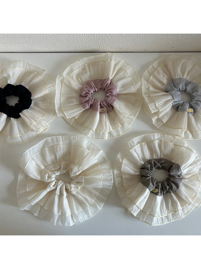 Chic large double layer lace scrunchie in soft beige fabric on white background