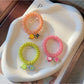 Gifty - Plastic Flower Bead Spiral Hair Tie