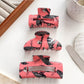 Side view of Beau crow pattern hair claw clip highlighting clip mechanism