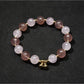 Detailed shot of heart pendant and beads on Lovra bracelet