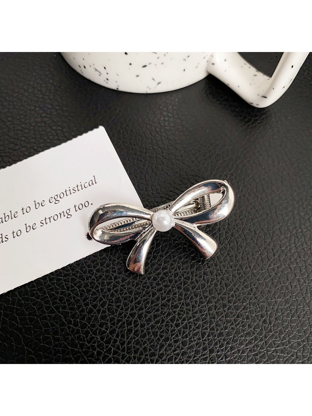 Top view of Beau classic bow hair clip showing symmetrical bow design