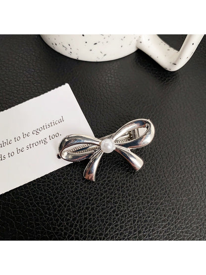 Top view of Beau classic bow hair clip showing symmetrical bow design