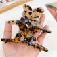 Close-up of Beau hair claw clip showing smooth matte finish and bow design