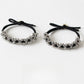 Gifty beaded hair tie worn on a wrist showing its simple and elegant design