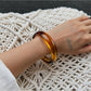 Lovra vintage ombre bangle bracelet with light reflection emphasizing ombre effect