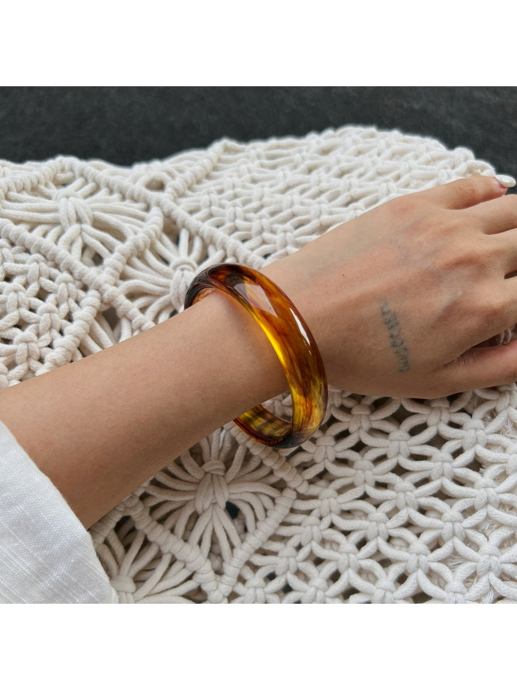 Lovra vintage ombre bangle bracelet with light reflection emphasizing ombre effect