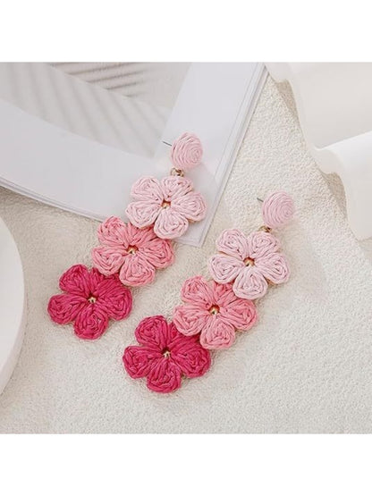 Pair of Bohemian style drop earrings with vibrant color blocks and gold hooks