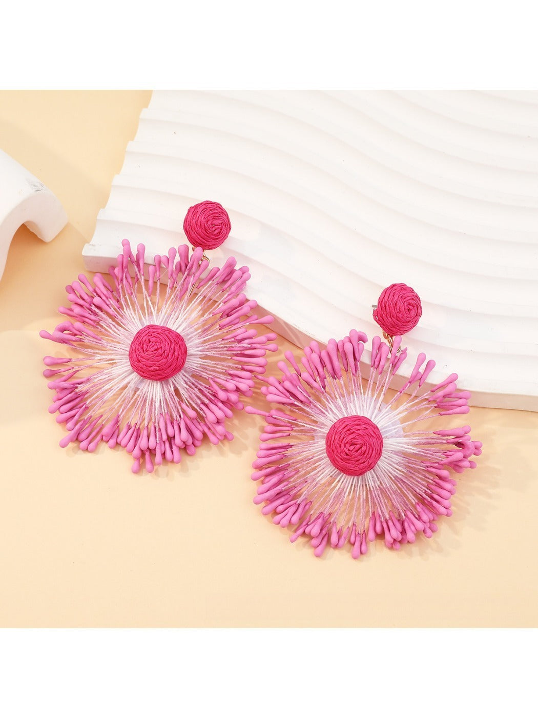 Sweet Flower Firework Shaped Earrings arranged with floral props