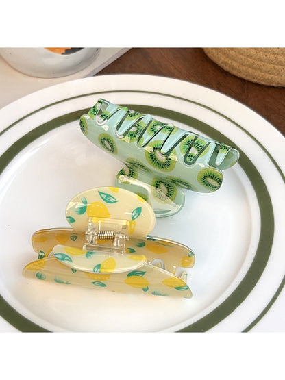 Beau fruit print shark claw clip holding hair in place