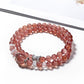 Lovra multi-wrap bracelet featuring polished strawberry quartz beads and silver accents