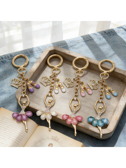 Close-up of ballerina charm showing detailed tutu and ballet shoes on keychain