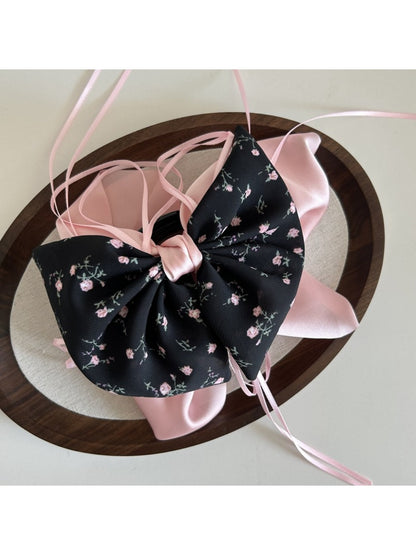 Beau Sweet Tiny Floral Bow Claw Clip angled to show clasp mechanism and bow detail