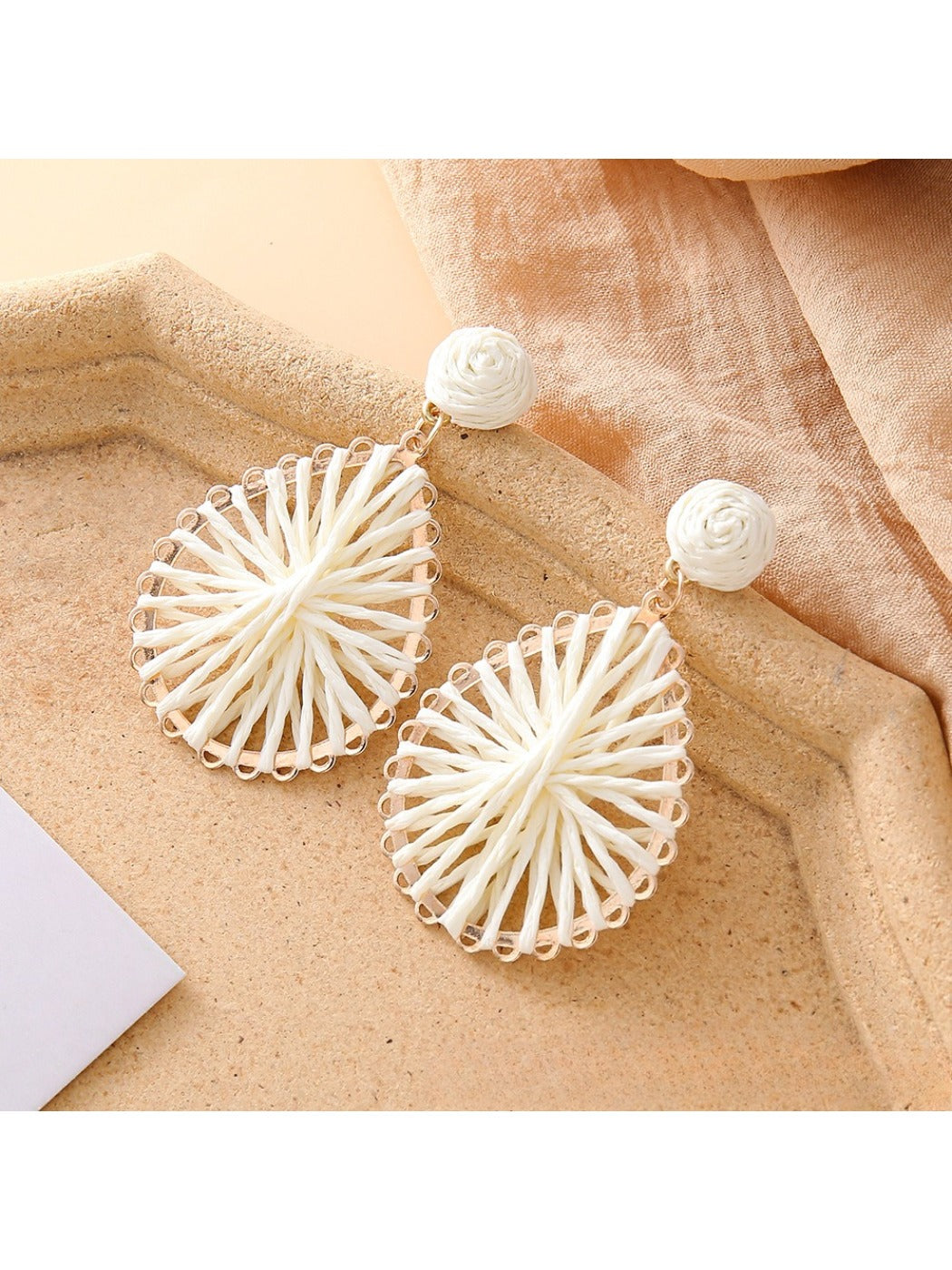 Model wearing Earedge raffia teardrop earrings with casual outfit