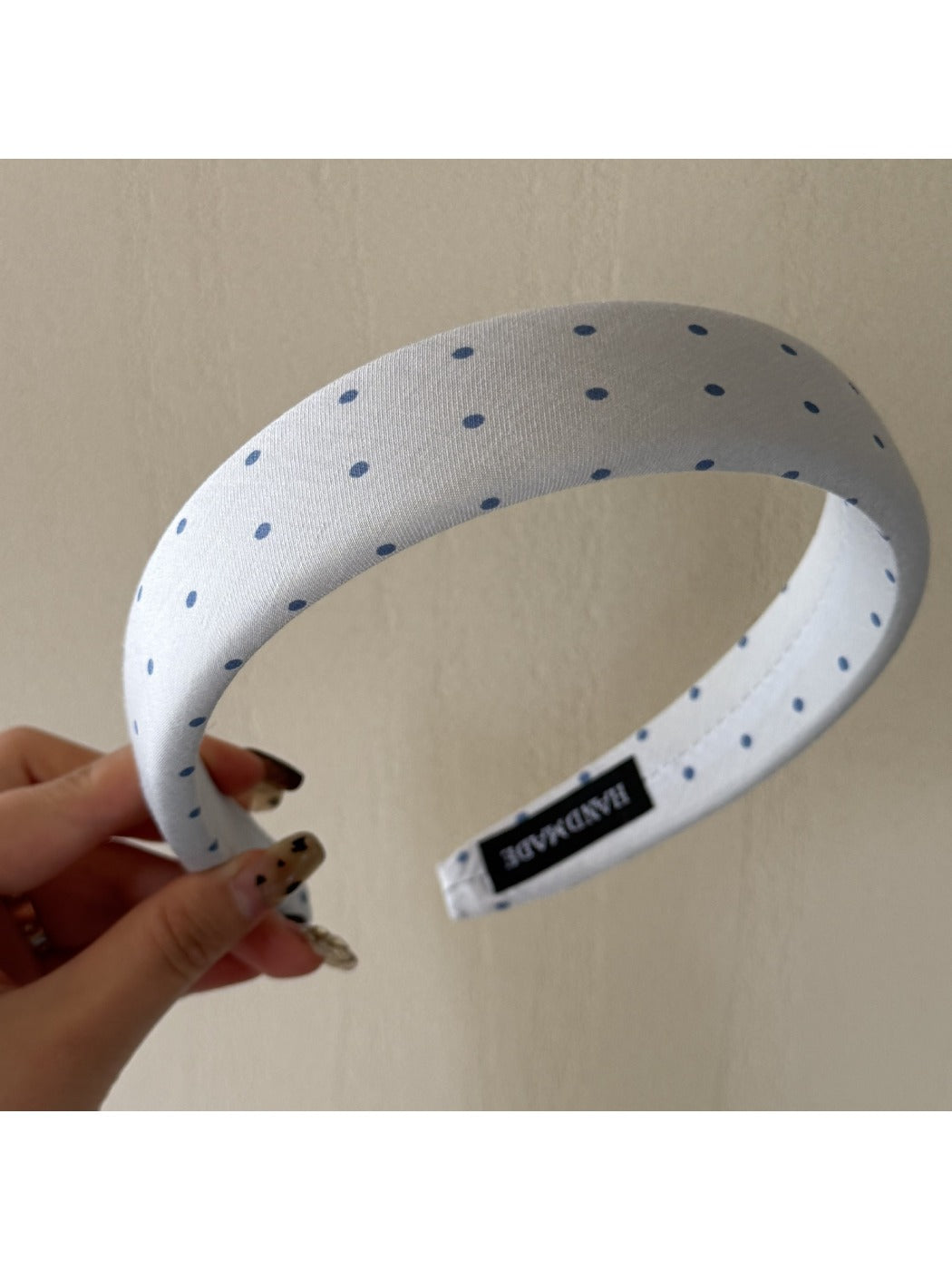 Model wearing Gifty polka dot headband paired with casual outfit