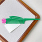 Camerow creative hair comb resting on a wooden table