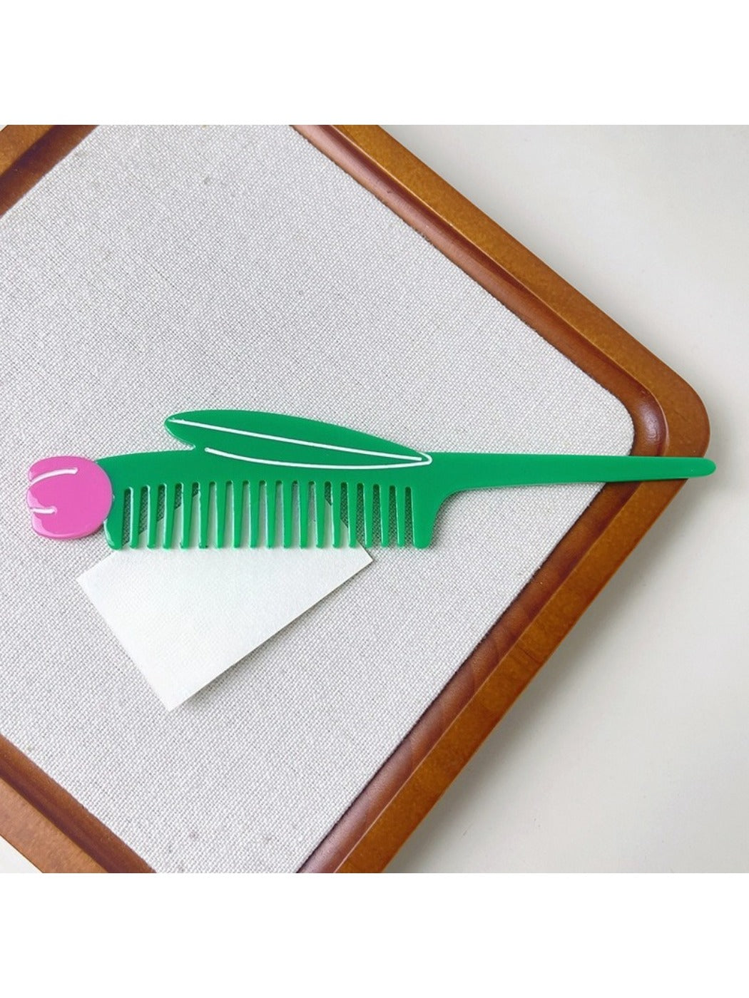 Camerow creative hair comb resting on a wooden table