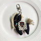 Fabric pony keychain with soft pastel colors and metal keyring on white background