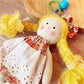 Close-up of Keypus cartoon doll keychain face with expressive eyes and smile