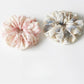 Side view of Gifty scrunchie highlighting ruched design and elastic band