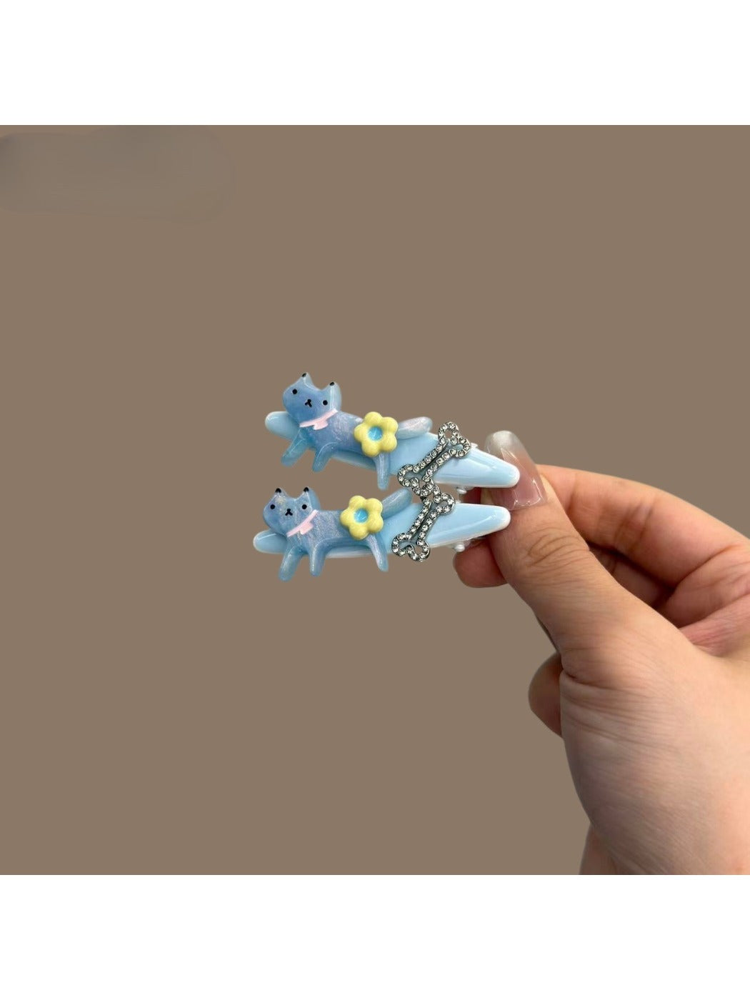 Close-up of Beau cat shaped hair clips showing detailed design and texture