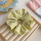Gifty color block stripe print scrunchie folded to show design details