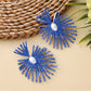 Earedge raffia drop earrings displayed in a jewelry box with soft fabric lining