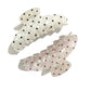 Close-up of Beau polka dot updo claw clip with black and white pattern
