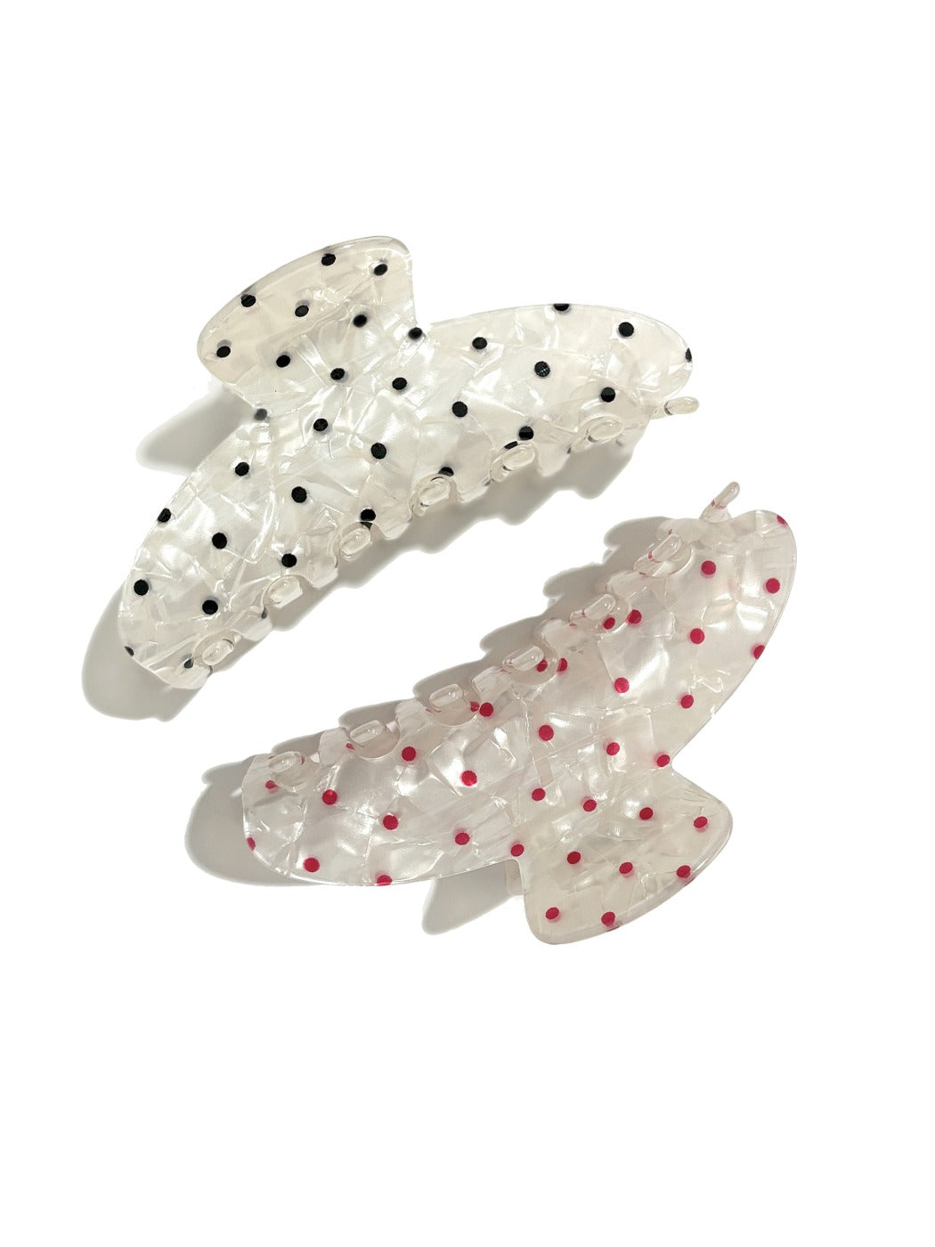 Close-up of Beau polka dot updo claw clip with black and white pattern