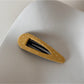 Beau hair clip clipped into a braid on light brown hair