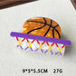 Beau claw clip basketball design held in hand demonstrating size and detail