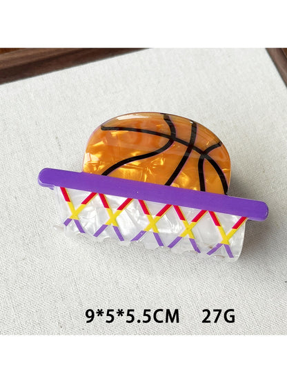 Beau claw clip basketball design held in hand demonstrating size and detail