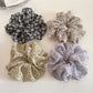 Gifty delicate daisy print scrunchie displayed flat showing full pattern