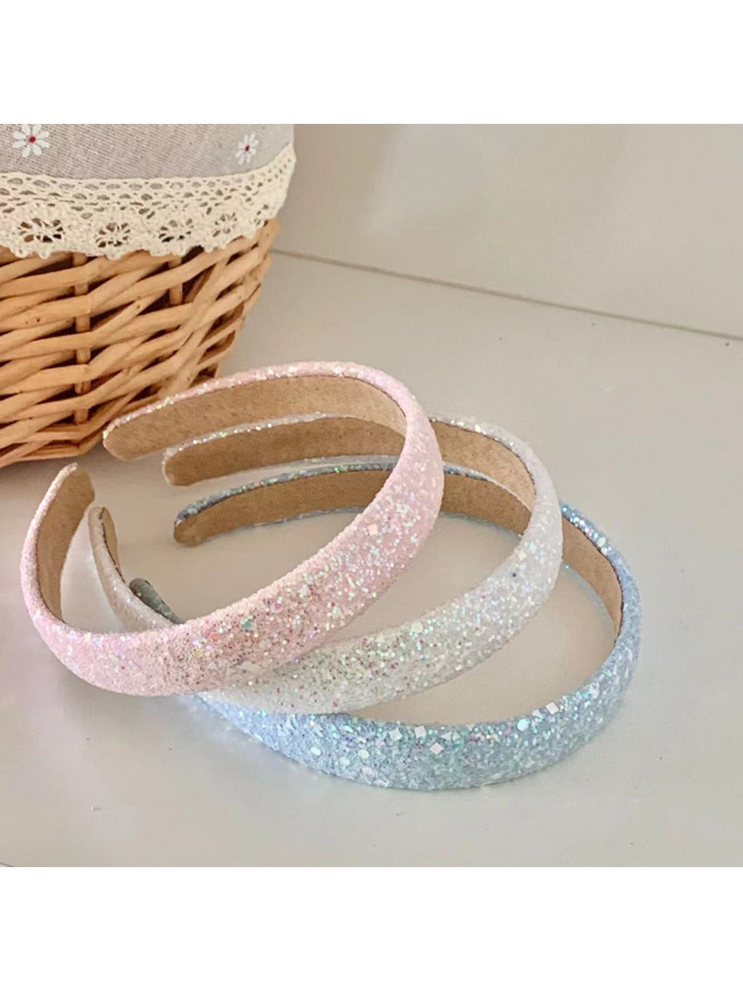Top view of Gifty Dreamy Sparkly Sweet Headband highlighting glitter texture and bow shape