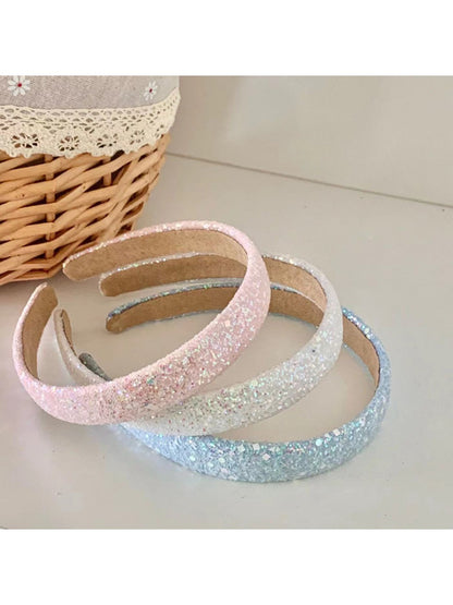 Top view of Gifty Dreamy Sparkly Sweet Headband highlighting glitter texture and bow shape