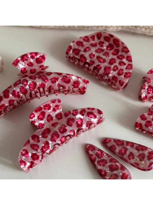 Close-up of Beau pink leopard print acetate hair clip on white background