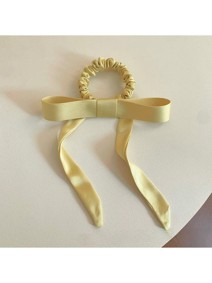 Gifty satin yellow ribbon bow scrunchie with soft sheen and gathered elastic