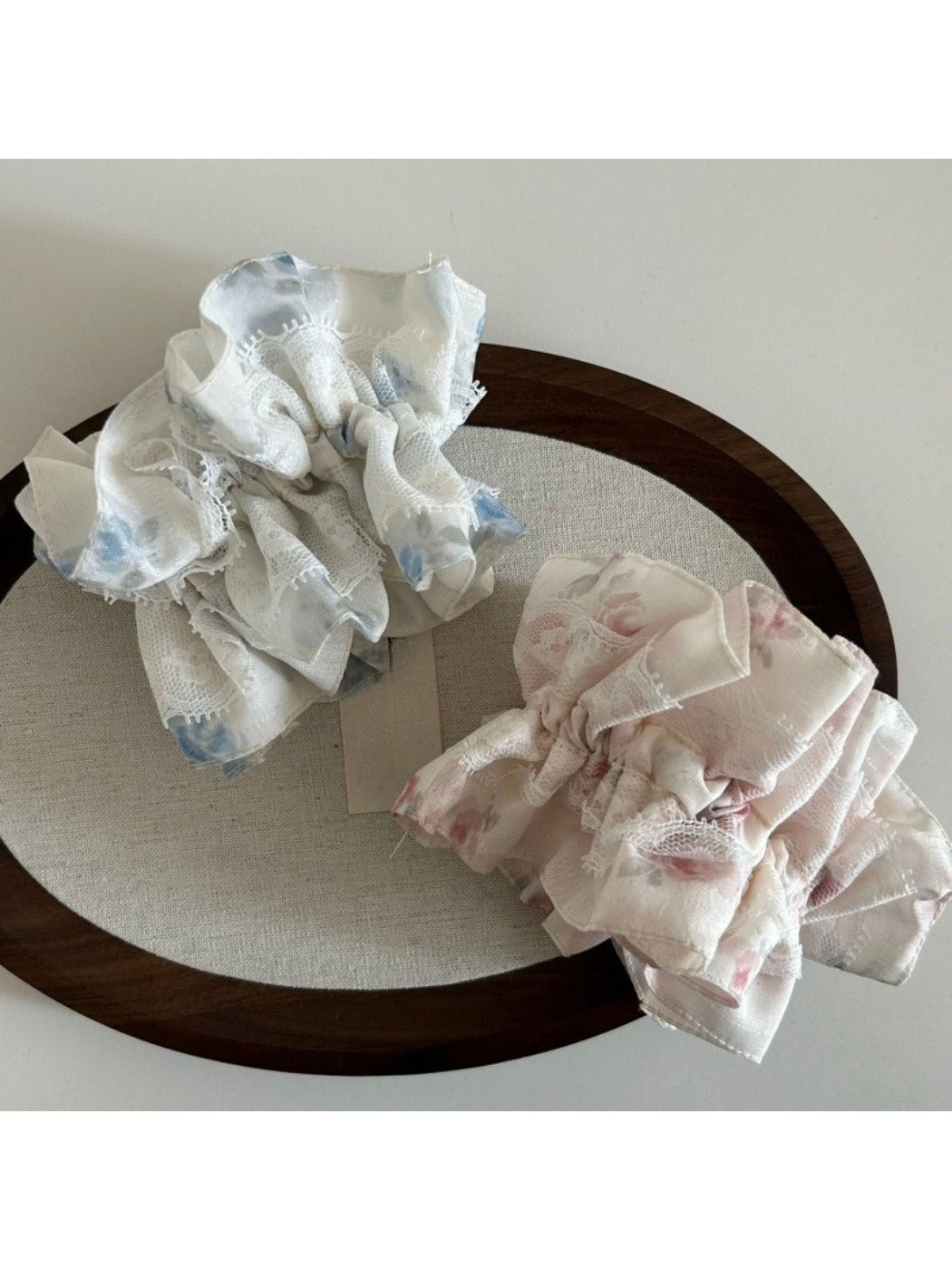 Gifty Sweet Lace Tiny Floral Scrunchie worn on a wrist as a stylish accessory