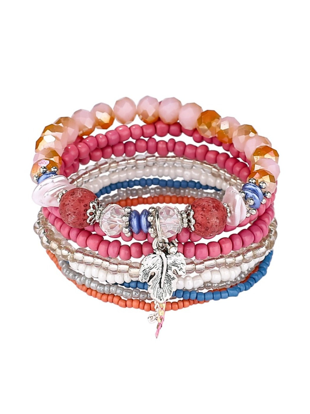 Lovra trendy stackable beaded bracelets displayed on a fabric surface with soft lighting