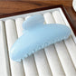 Top view of Beau half round hair clip showing smooth curved design