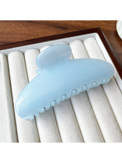 Top view of Beau half round hair clip showing smooth curved design