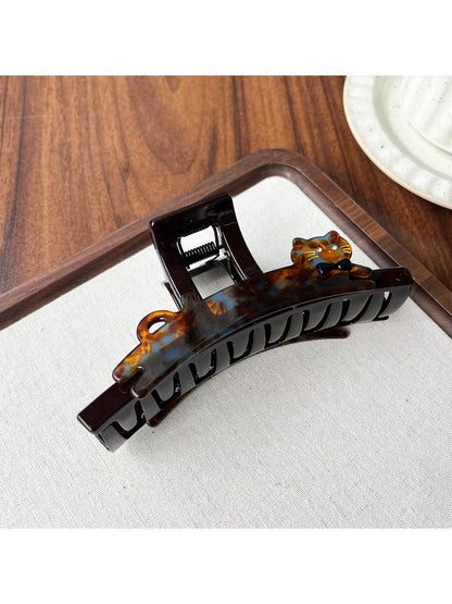Beau claw clip in natural light, showcasing glossy acetate finish