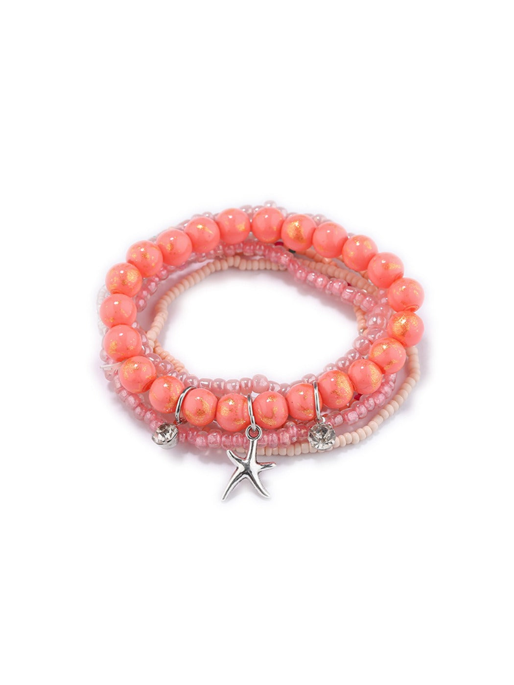 Detailed shot of Lovra bracelet star pendant and textured black beads