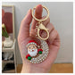 Christmas Santa crescent moon keychain held in hand