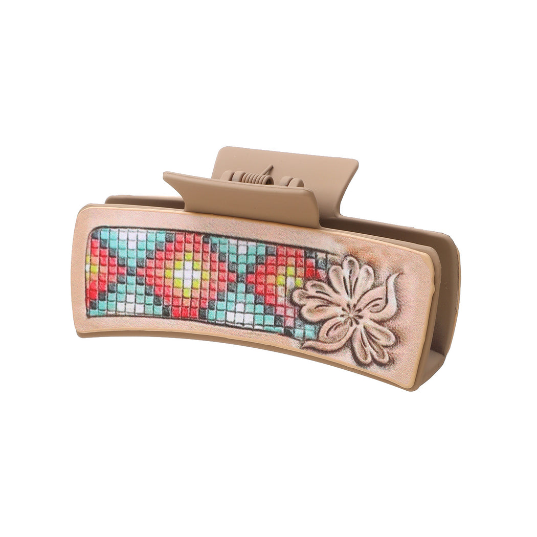 Turquoise mosaic floral hair claw on white background