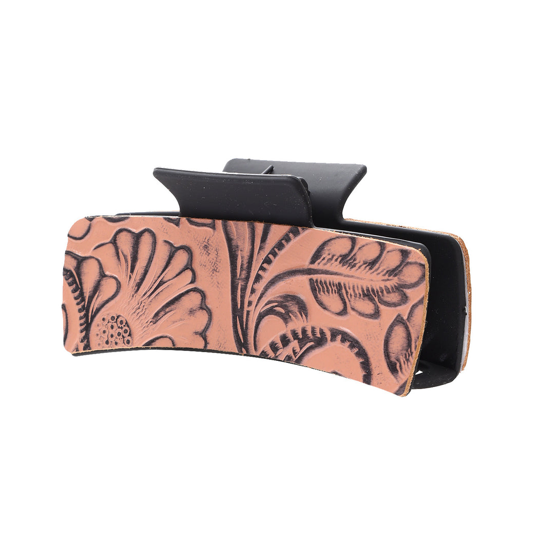 Coral floral hair claw on white background