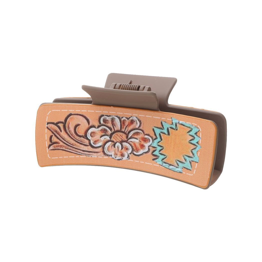 Coral floral hair claw on white background